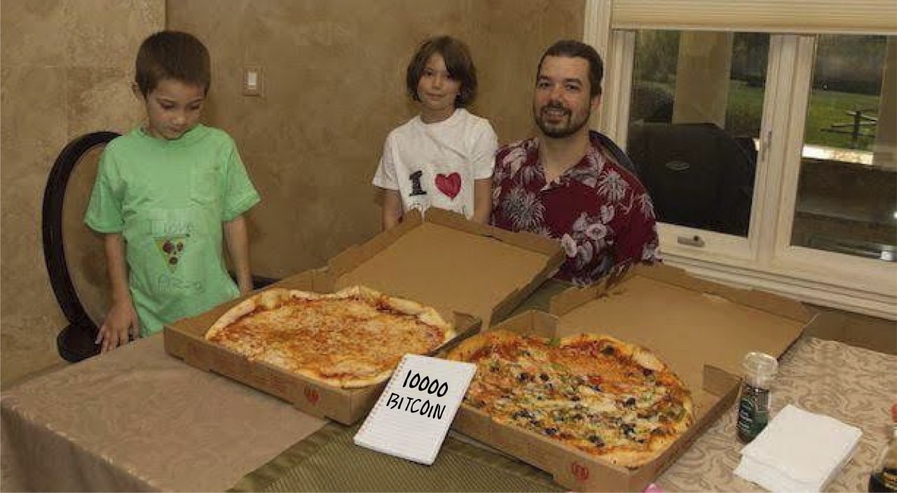 family enjoying pizza